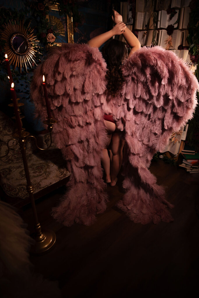 Luxurious boudoir shot embracing wings and sensuality in Carefree, Arizona