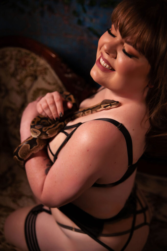 Bold and enticing boudoir image with snake, evoking a sense of luxury and kinkiness in Carefree, AZ