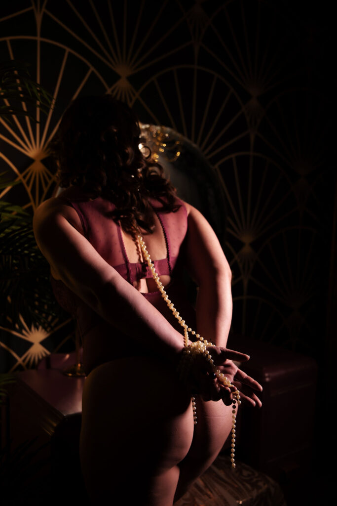 Empowering boudoir photograph celebrating the sensuality and confidence of a woman in Shibari in Carefree, AZ